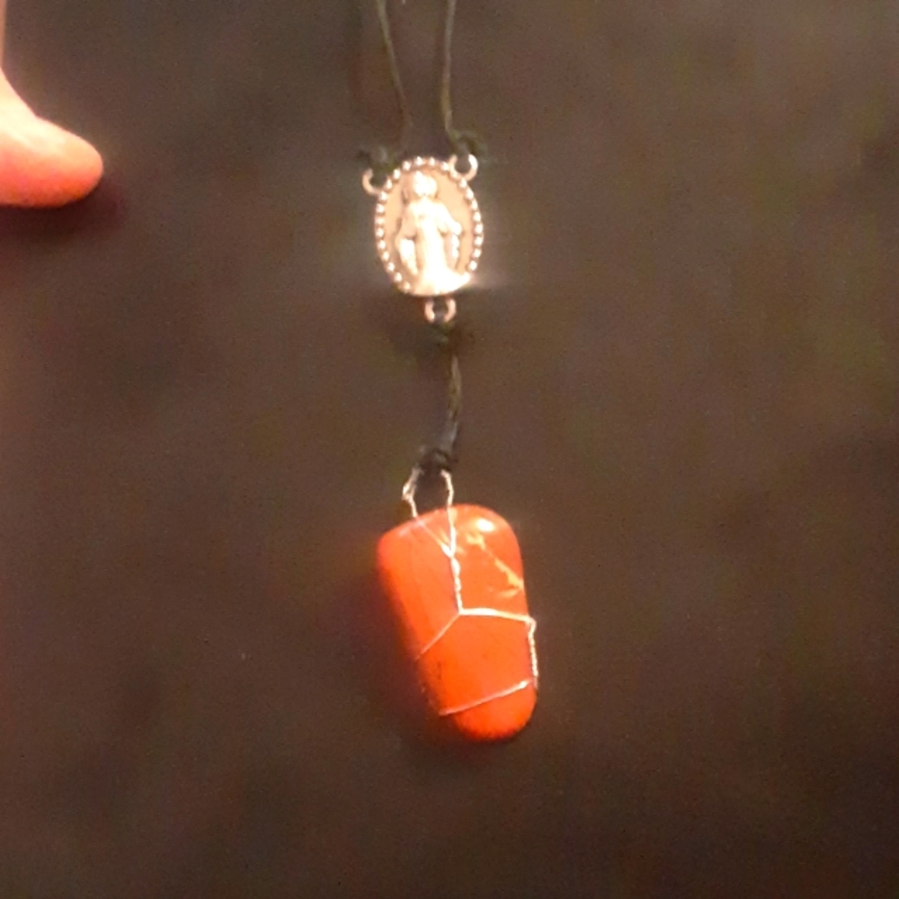 Rosary pendant with a hanging polished jasper gemstone on black hemp cord